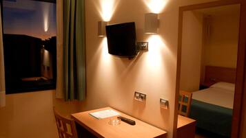 Desk, blackout curtains, iron/ironing board, rollaway beds