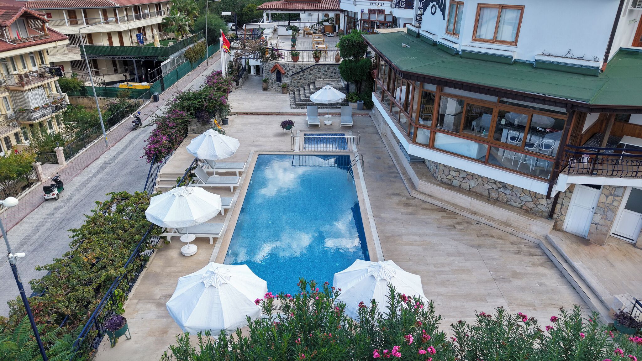 Outdoor pool, a waterfall pool, sun loungers