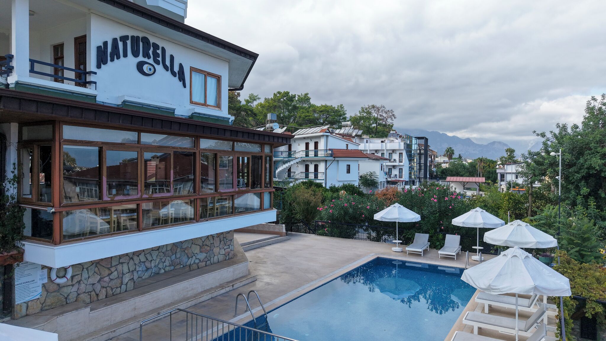 Outdoor pool, a waterfall pool, pool loungers