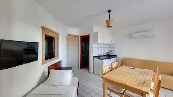 Apartment, 1 Bedroom | Living area | TV