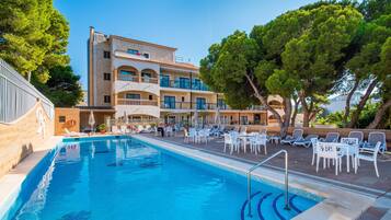 Outdoor pool, a rooftop pool, open 7:30 AM to 8:00 PM, pool umbrellas