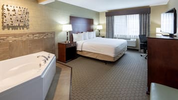 Room, 1 King Bed, Jetted Tub | Desk, iron/ironing board, free cribs/infant beds, free rollaway beds