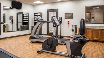 A fitness center with treadmills, an elliptical, and a stationary bike.