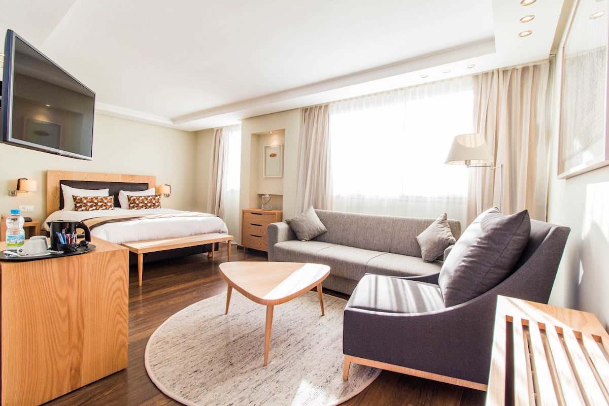 superior suite, terrace | living area | flat-screen tv