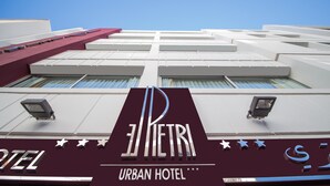 The exterior of the El Piriti Urban Hotel with a prominent sign and a modern architectural design. - Le Pietri Urban Hotel (Rabat)