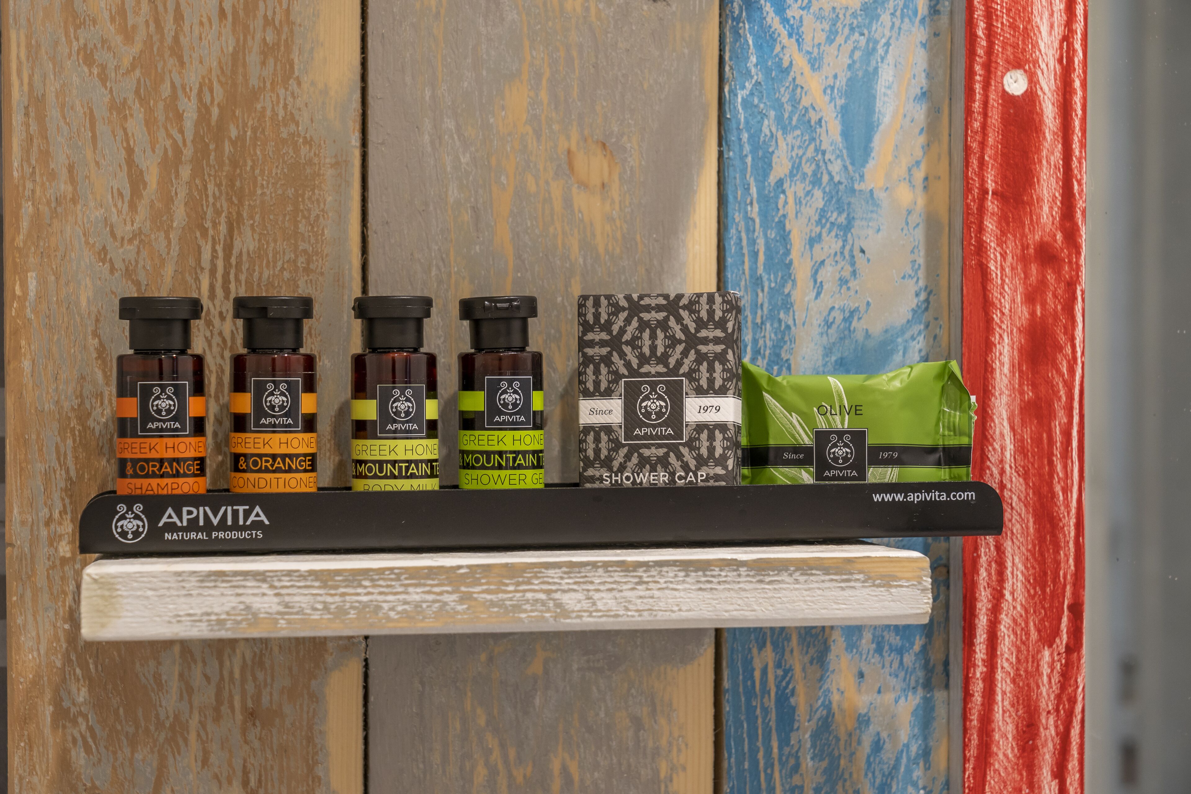 designer toiletries, hair dryer, towels