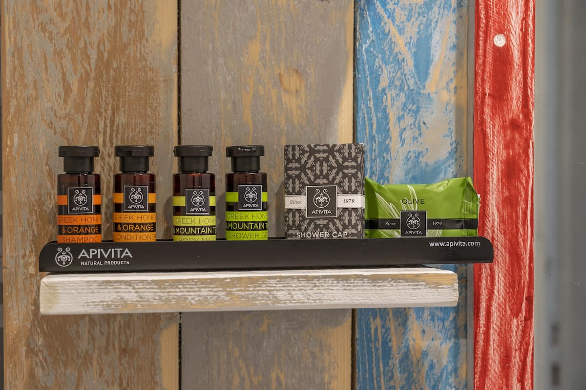 designer toiletries, hair dryer, towels