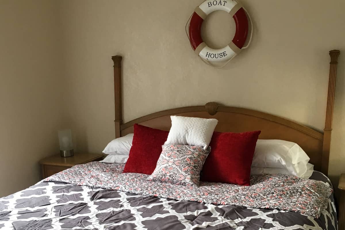Apartment, 1 Bedroom, Pool View | 1 bedroom, iron/ironing board, WiFi (free), individually decorated