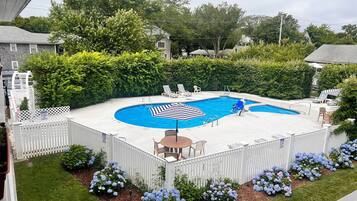 Seasonal outdoor pool, open 10:00 AM to 7:00 PM, pool umbrellas