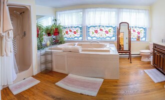 Premium Suite, 1 King Bed, Jetted Tub | Bathroom | Shower, free toiletries, hair dryer, bathrobes