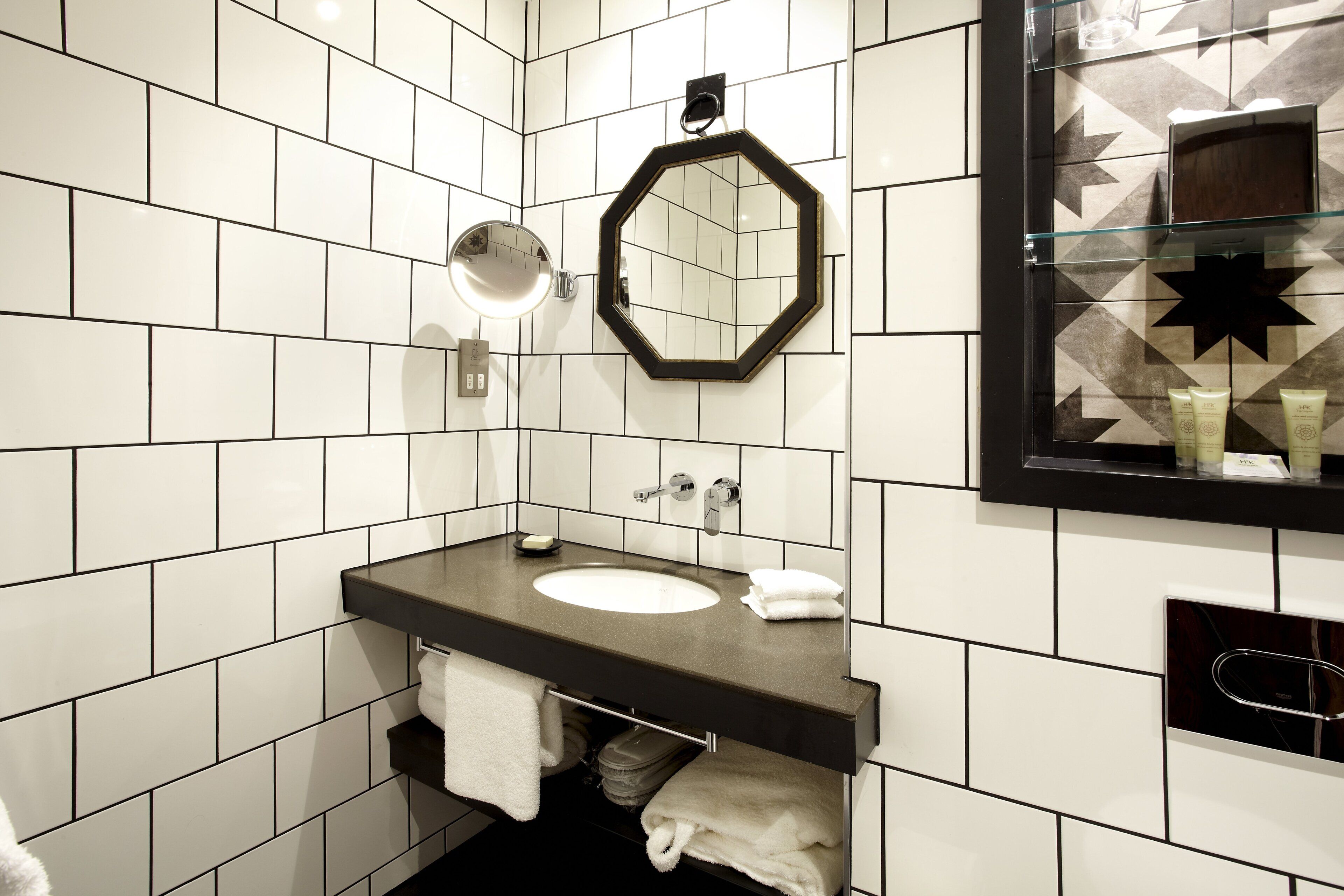 designer toiletries, hair dryer, bathrobes, slippers