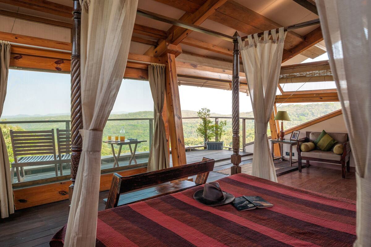 Forest Machan with Private Deck | Minibar, in-room safe, desk, laptop workspace