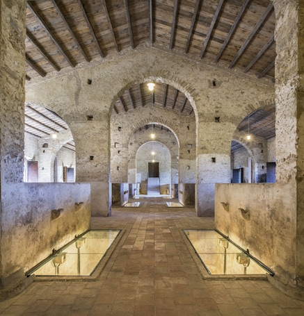 An interior with arched ceilings and a central open space.