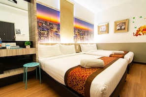 A hotel room with two beds, a desk with a computer, and a small stool. - Hotel Zamburger Mariam Melaka (Malacca City)