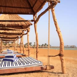 Private beach, white sand, sun loungers, beach umbrellas