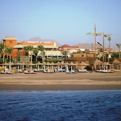 Private beach, white sand, sun loungers, beach umbrellas
