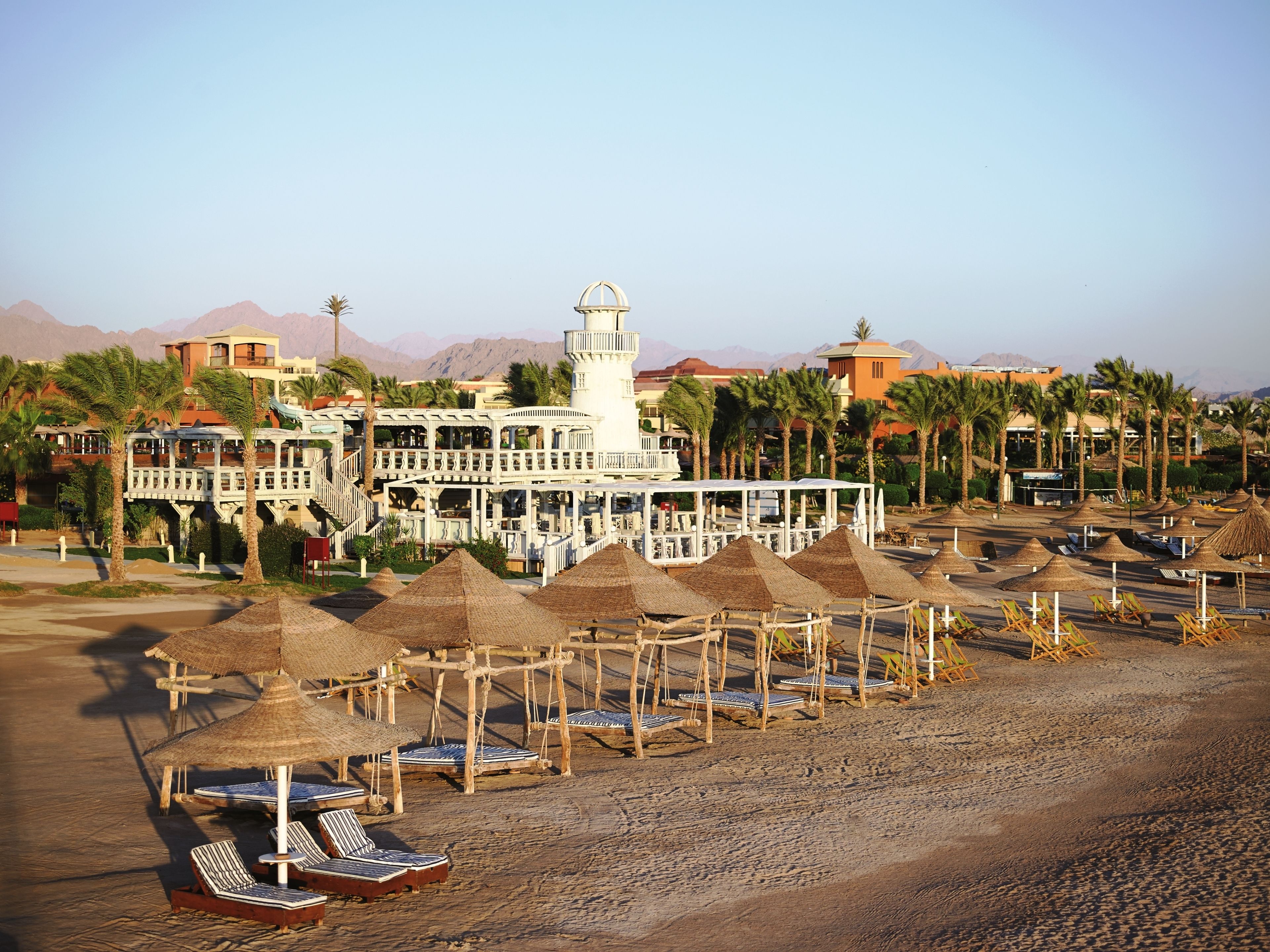 Private beach, white sand, sun loungers, beach umbrellas