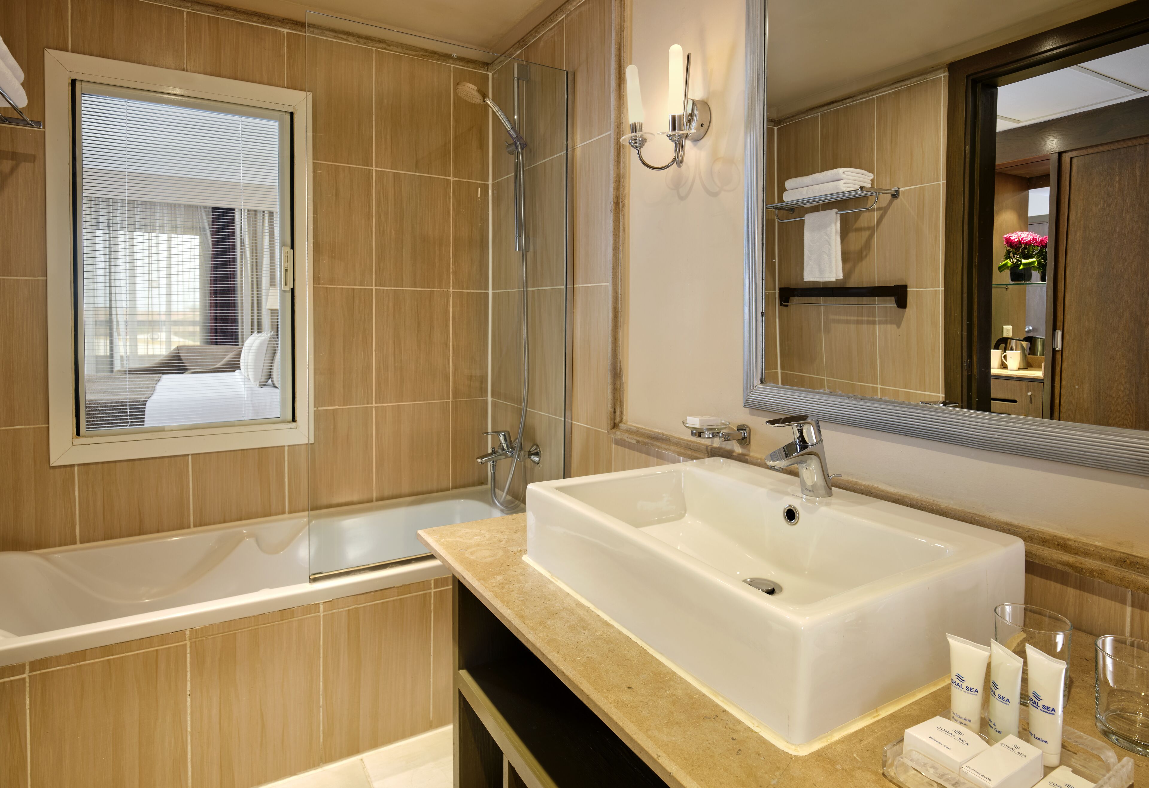 shower, hair dryer, slippers, towels