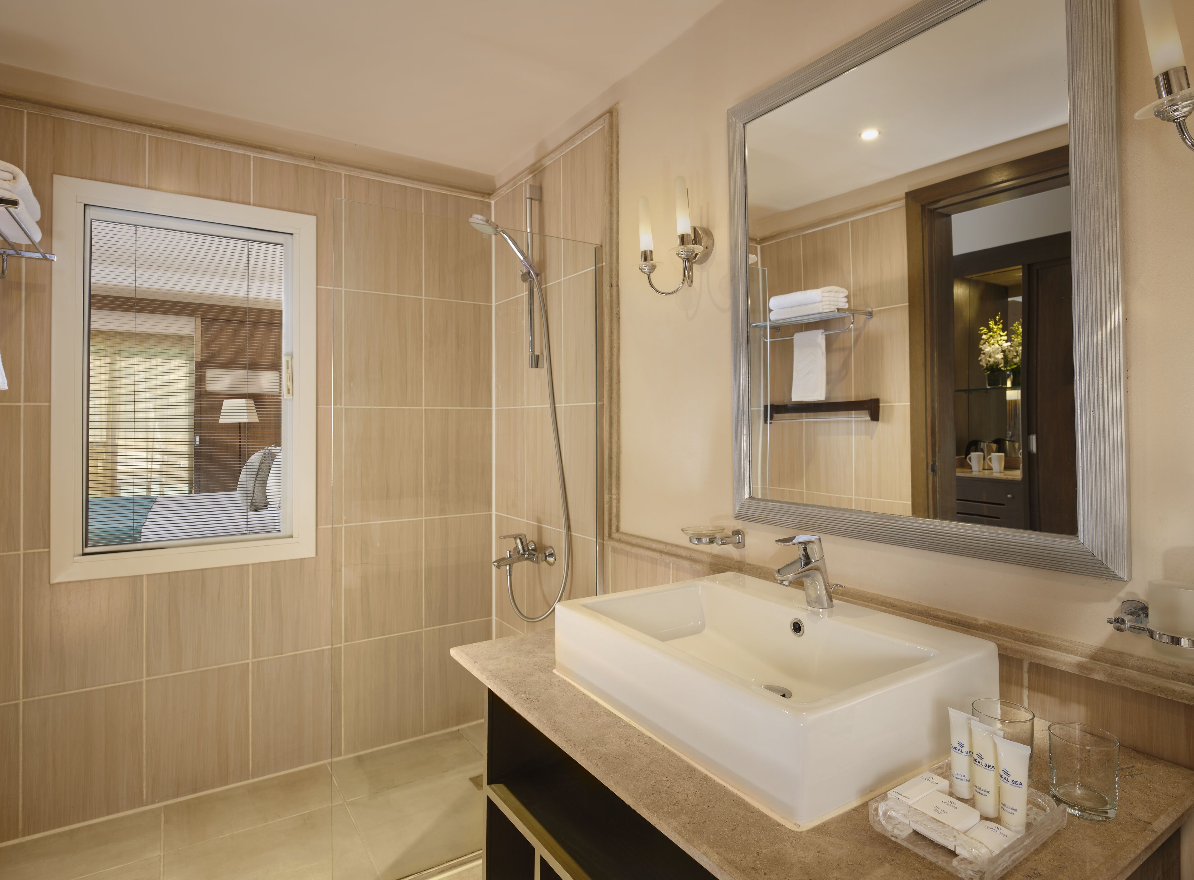 shower, hair dryer, slippers, towels