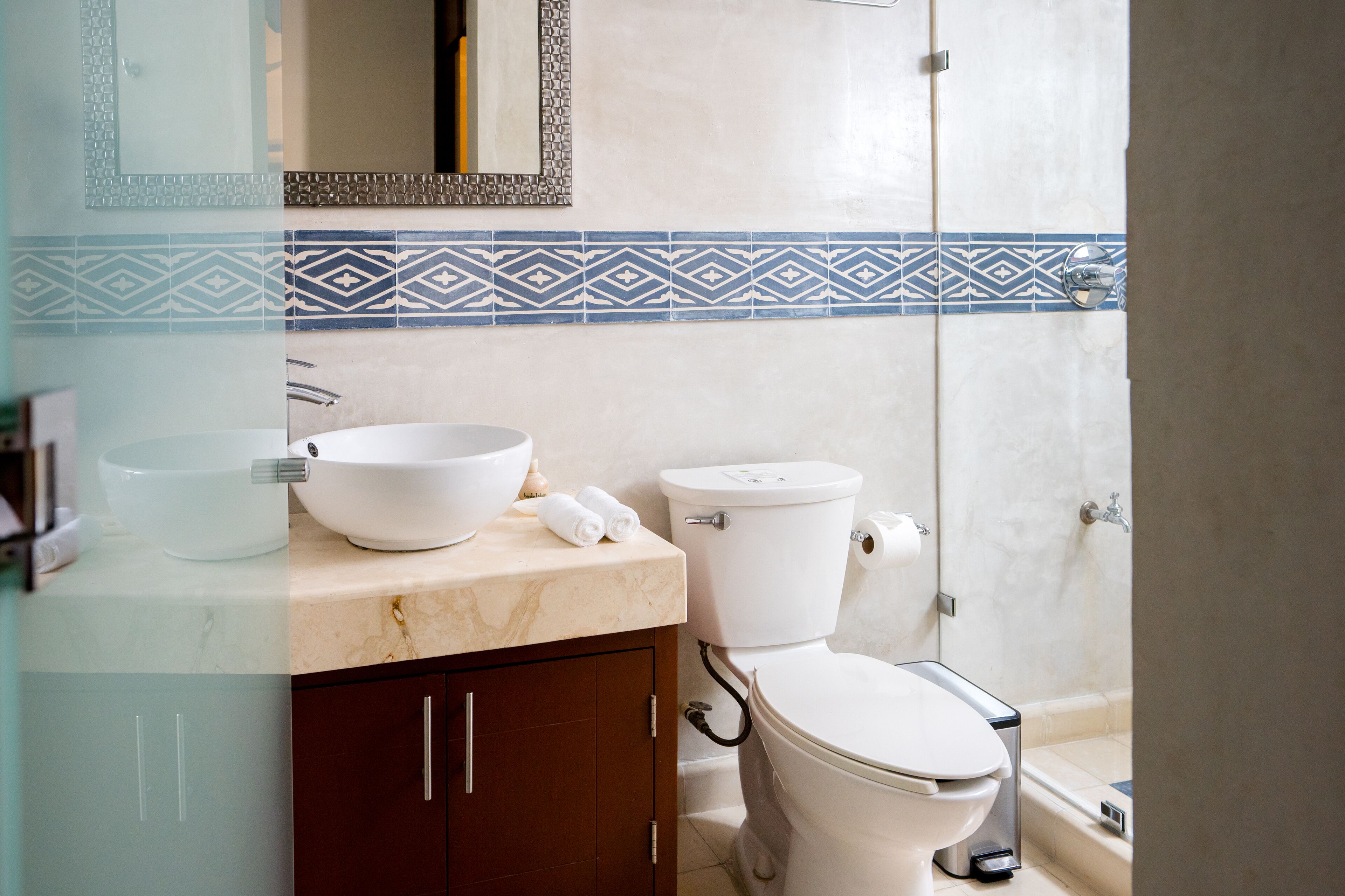 deluxe room, 1 queen bed | bathroom | shower, free toiletries, bathrobes, towels