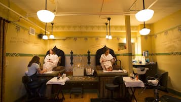 Experience a unique salon with a vintage aesthetic, featuring a reception area and professional hairdressing tools.