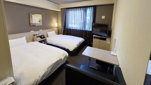 A hotel room with two beds, a desk, a television, and a window with curtains. - Hotel Route-Inn Annaka (Annaka)