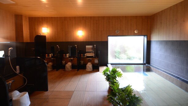 A modern bathroom with wooden paneling, a large window, and a plant. - Hotel Route-Inn Annaka (Annaka)