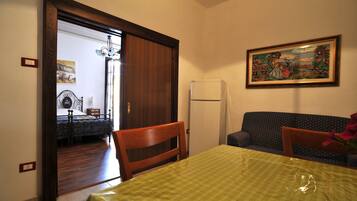 Apartment, 1 Bedroom | 3 bedrooms, down duvets, in-room safe, iron/ironing board