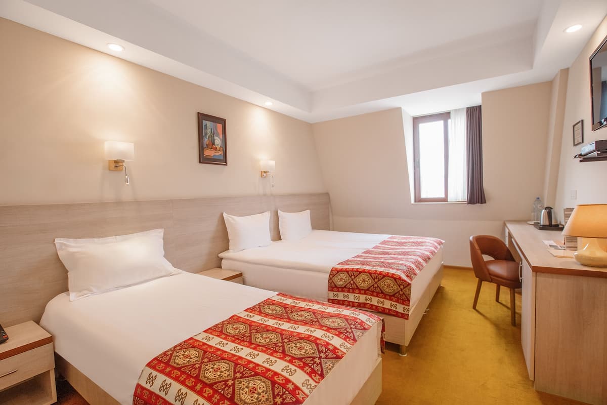 Economy Family Room | Premium bedding, minibar, desk, laptop workspace