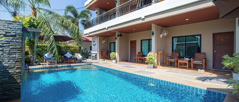 Outdoor pool, open 7 AM to 8 PM, pool umbrellas, pool loungers