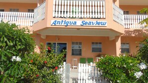 A building with a sign reading "Antigua Seaview." - Antigua Seaview (St. John's)
