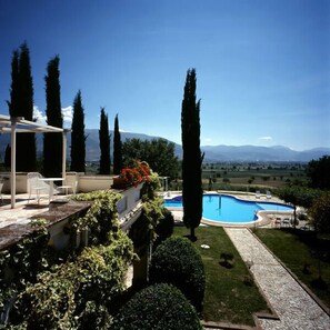 Seasonal outdoor pool, pool umbrellas, pool loungers