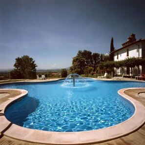 Seasonal outdoor pool, pool umbrellas, pool loungers