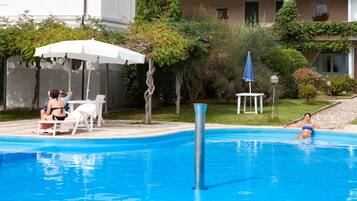 Seasonal outdoor pool, pool umbrellas, sun loungers