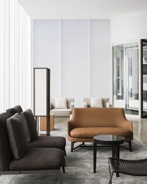A modern living room with a sofa, armchairs, and a coffee table. - Little National Hotel Canberra (Barton)
