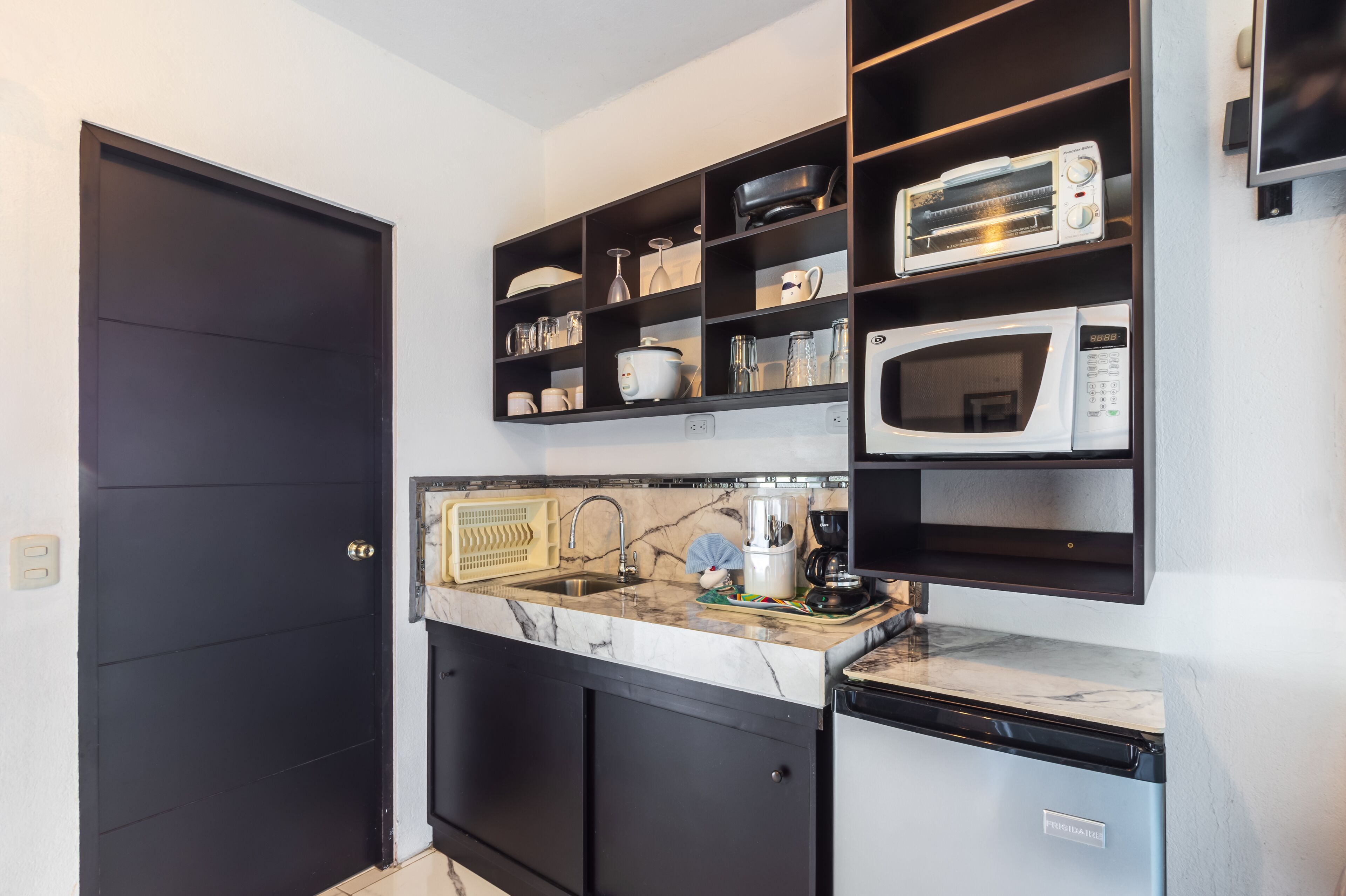 comfort room | private kitchen | full-sized fridge, microwave, oven, coffee/tea maker