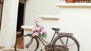 A staircase with wooden railings leading to an upper level. - Huenchandee (Chiang Rai)