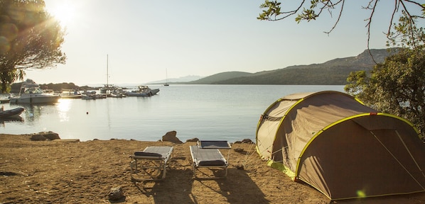 On the beach, sun-loungers, beach umbrellas, snorkelling