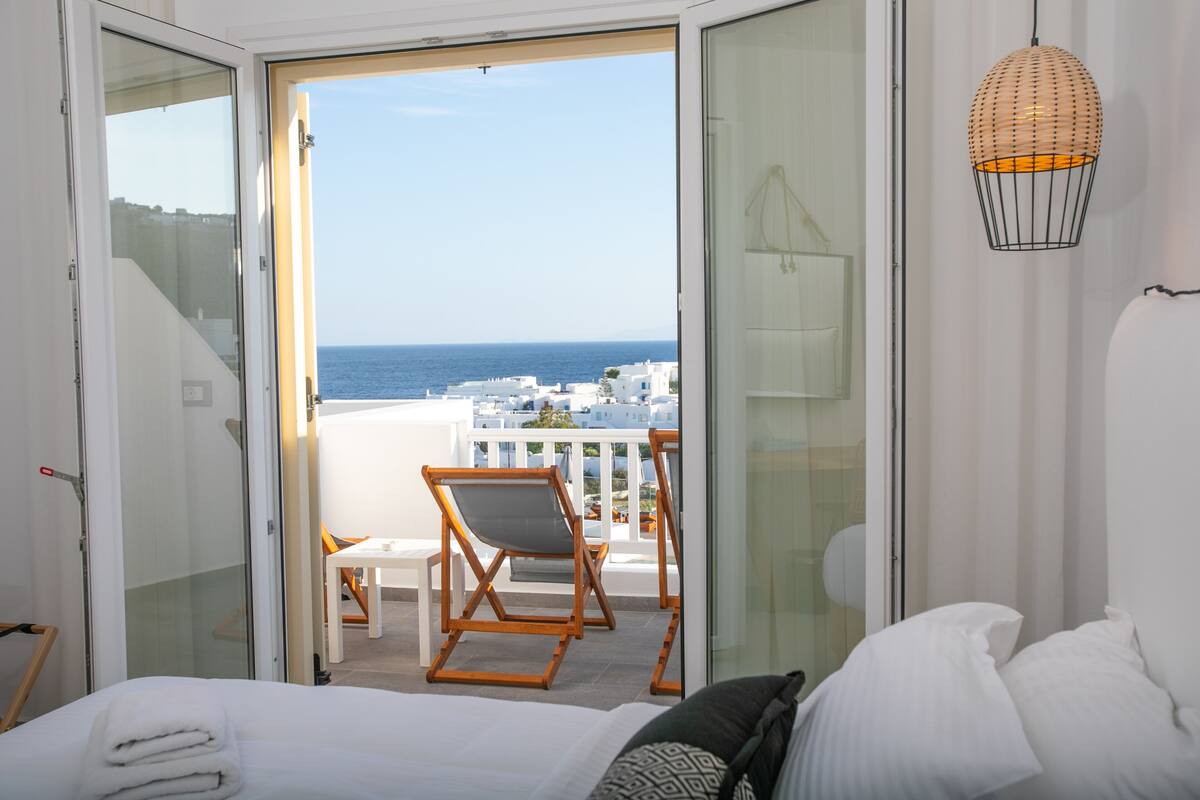 deluxe quadruple room, 1 bedroom, sea view | 2 bedrooms, premium bedding, in-room safe, desk