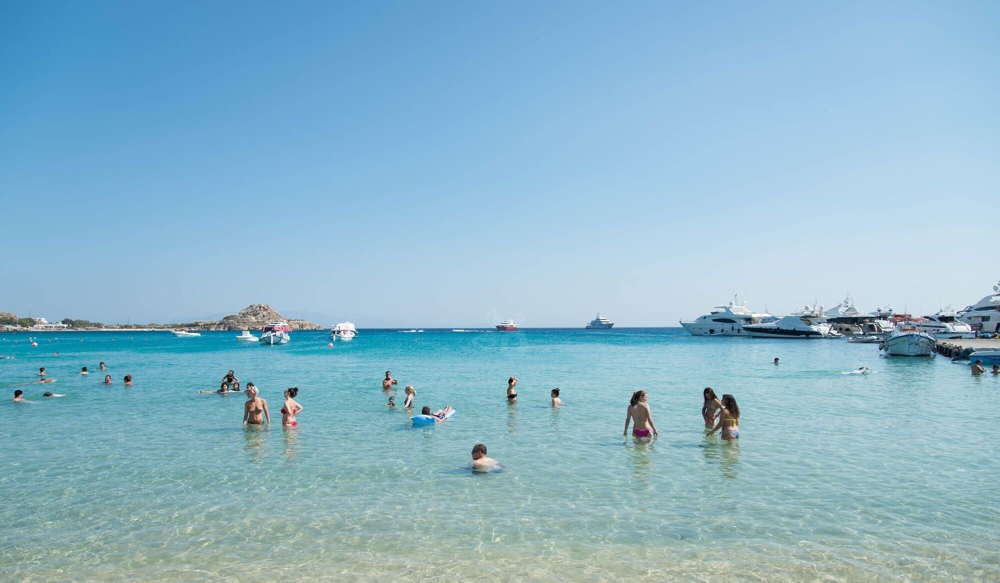 on the beach, white sand, sun-loungers, beach umbrellas