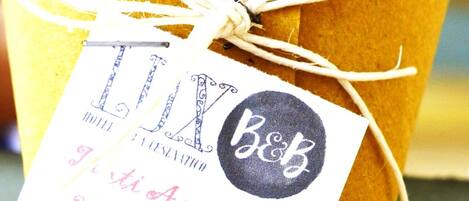 A wrapped gift with a tag that reads "TX Hotel & Spas" and includes a website URL.