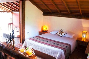 Bungalow, Pool View | Minibar, blackout drapes, bed sheets