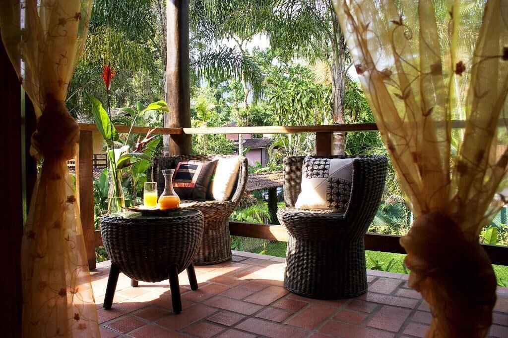 Chalé standard | Frigobar, cortinas blackout, roupa de cama