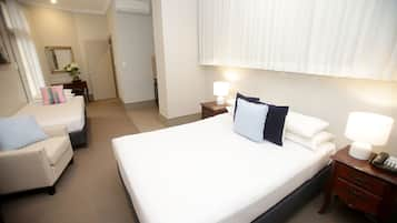 Studio Family Suite (1 Queen Bed and 1 Single Bed) | In-room safe, desk, iron/ironing board, cots/infant beds