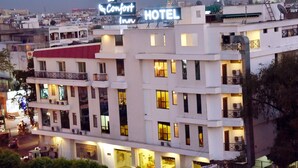 A hotel with multiple floors, balconies, and a sign indicating it is a hotel. - Hotel Yulia (Jaipur)