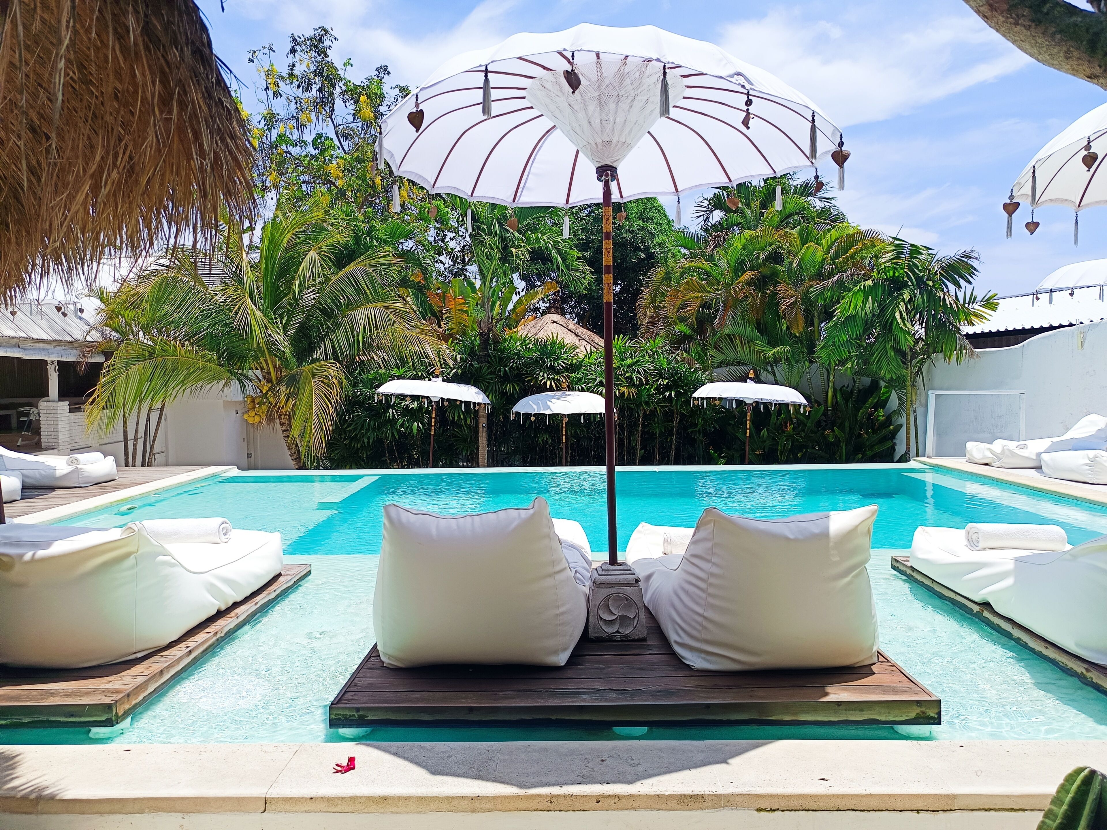 Outdoor pool, pool umbrellas, sun loungers