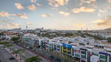 A commercial area with multiple buildings, including a prominent sign for 'WISMA GBK'.