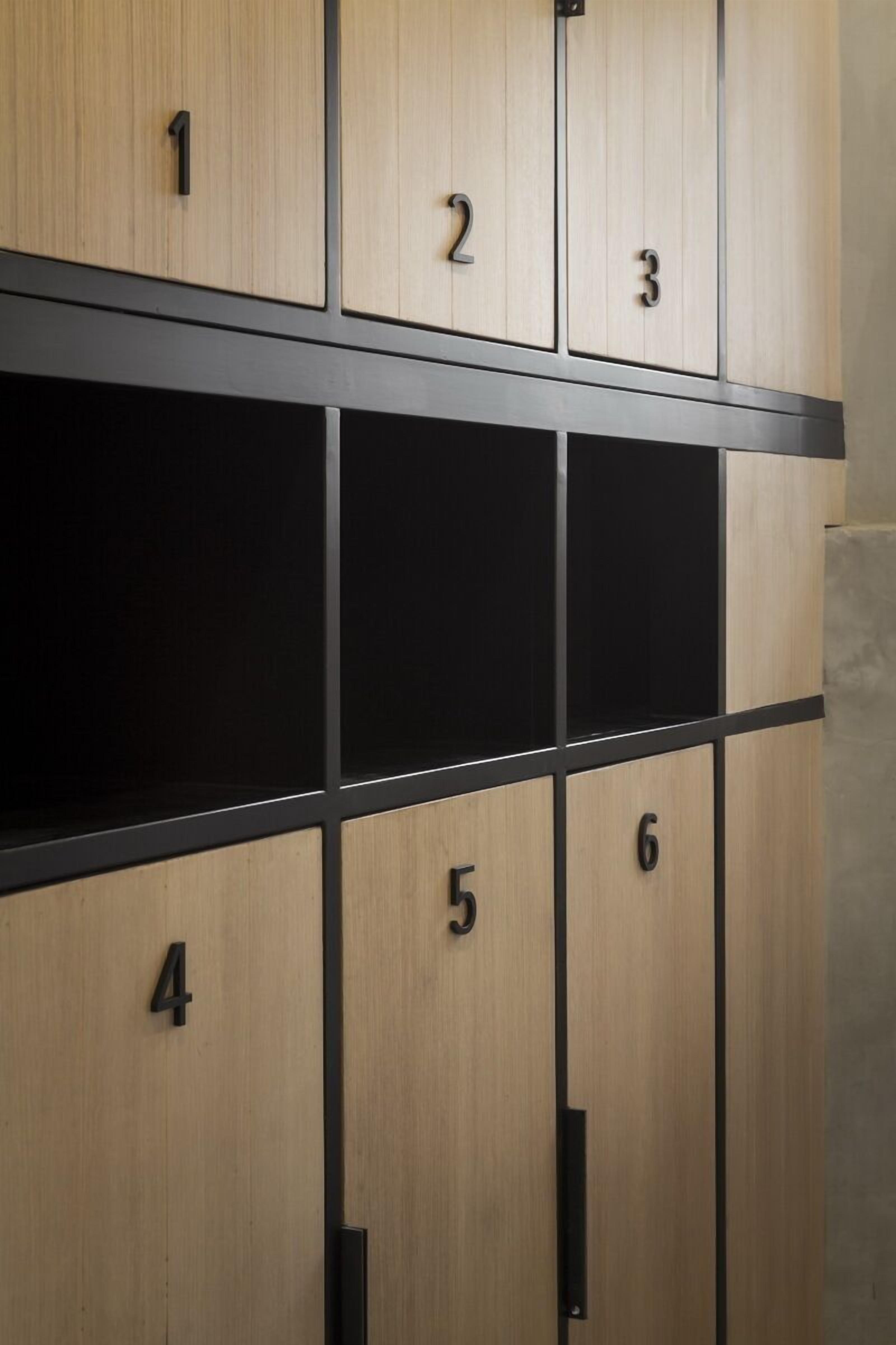 A set of wooden lockers with numbers 1 to 6, arranged in two rows.