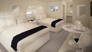 A modern hotel room with two beds, a round dining table, and a small seating area. - Sun Plaza Motel (Silver Springs)