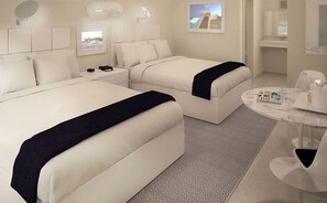 A hotel room with two beds, a round table, and a small seating area. - Sun Plaza Motel (Silver Springs)